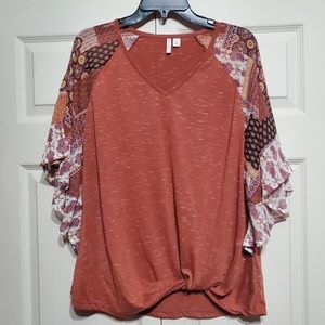 Cute polyester and 1% Rayon top. Soft and flowy with cute little tie knot. Large